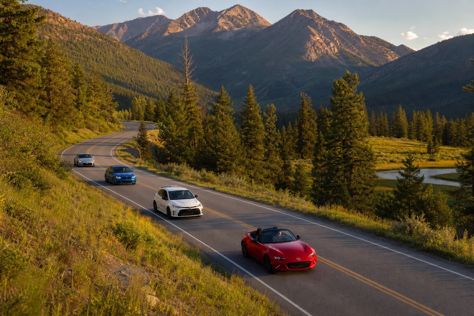 Mixed enthusiast cars on a scenic rally through a mountain park